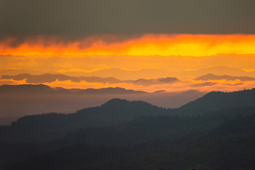 Sunrise.Mountain valley during sunrise. Natural summer landscape.Lighting before sunrise at the morning time.Thailand.