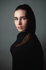 Scared young woman. Studio portrait