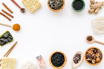Geometric design with Chinese, Japanese products, noodles, weeds, spices, mushrooms on white background top view mockup