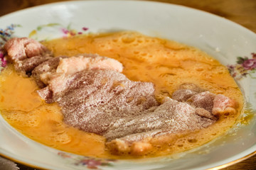 Preparing chicken meat schnitzel