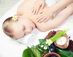 Obraz na płótnie Canvas Spa massage. Beautiful young woman getting spa massage. Top view