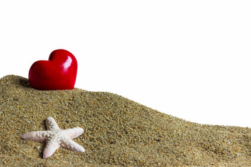 Fototapeta na wymiar red heart on beach sand isolated on a white background