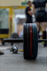 Fototapeta na wymiar bar weight on the floor of a gym 