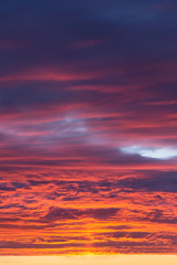 Obraz premium Beautiful epic dramatic sunset orange pink blue sky with clouds background texture