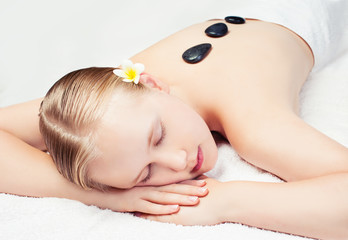 Obraz na płótnie Canvas Spa relax massage in salon. Beautiful young woman getting spa massage