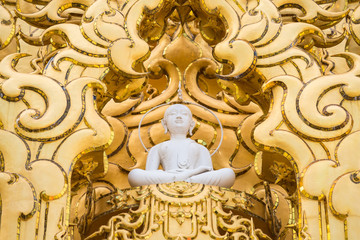 White monk statue at white temple Wat Rong Khun, Chiangrai, Thailand.