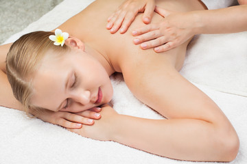 Obraz na płótnie Canvas Spa massage concept. Beautiful young woman getting spa massage
