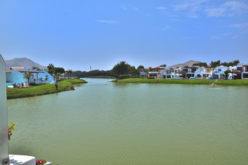 Artificial lagoon surrounded by houses