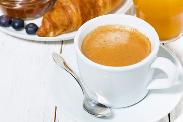 espresso and croissants for breakfast, closeup