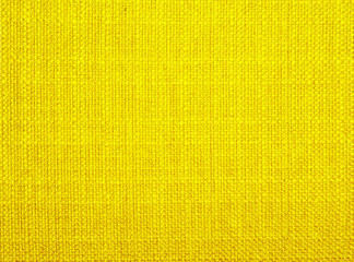 Background  of textured yellow natural textile 