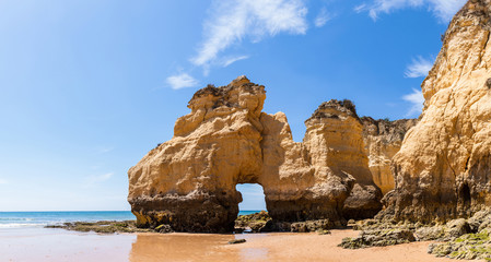 The rocky cliffs of Vale do Olival beach in Armacao de Pera, Portugal