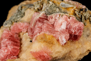 Macro stone cobalt calcite mineral on a black background