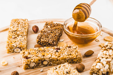 Museli, cereal, granola protein energy bars and honey