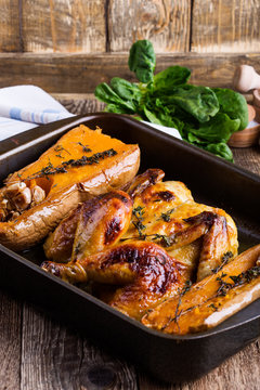 Roasted chicken with seasonal autumn butternut squash, garlic and herbs