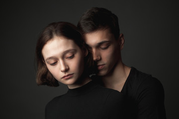 Young woman and young man in studio.
