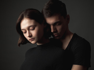 Young woman and young man in studio.