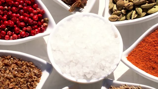 Spices. Various Indian. Spice and herbs rotate. Assortment of Seasonings, condiments. Cooking ingredients, flavor. 4K video Beautiful view