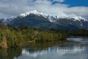 Rio Yelcho in the Aysen Region of southern Chile. Large body of fresh water surrounded by lush forest and snow capped mountains.