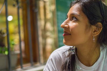 Young indian woman looking aside