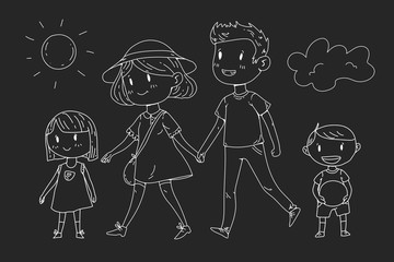 Young happy family walking in park with little children