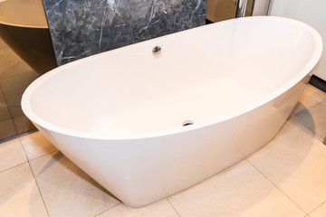 Beautiful luxury white bathtub decoration in bathroom interior