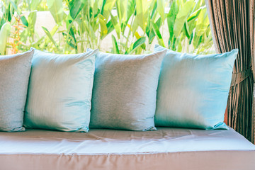 Pillow on sofa chair decoration outdoor patio with garden view