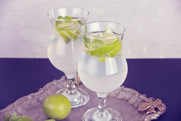 Lemonade or mojito cocktail with lemon and mint, cold refreshing drink or beverage