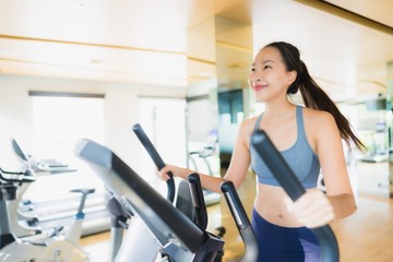 Portrait asian woman exercising and work out in gym