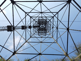 The pylon of the cableway that connects the towns of Albino and Selvino. Green painted pylons to camouflage them in the woods