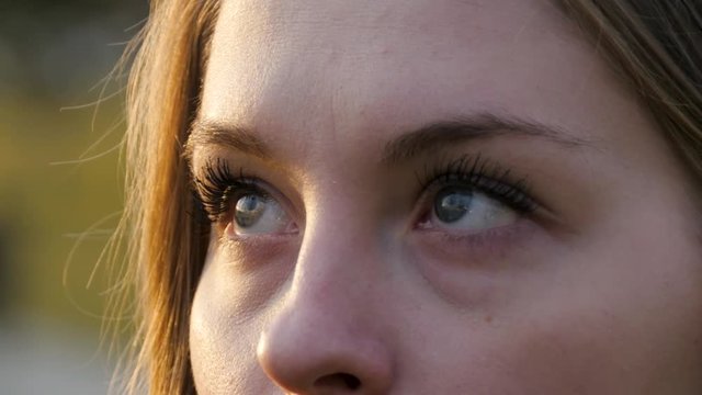 The girl's eyes look to the top.