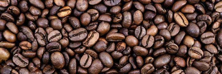 Coffee grains. Background of roasted coffee beans brown. layout. Flat lay.