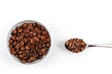 Cup and spoon filled with roasted coffee grains. coffee. layout. Flat lay.