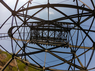 The pylon of the cableway that connects the towns of Albino and Selvino. Green painted pylons to camouflage them in the woods