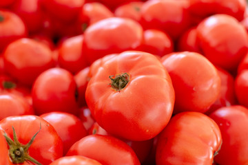 Red ripe tomatoes on farmets market close up