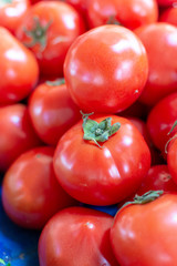 Red ripe tomatoes on farmets market close up