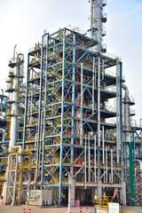 Close-up of pipelines and destillation tanks of an oil-refinery plant