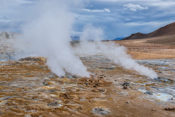 Hverir geothermal area with boiling mudpools and steaming fumaroles in Iceland