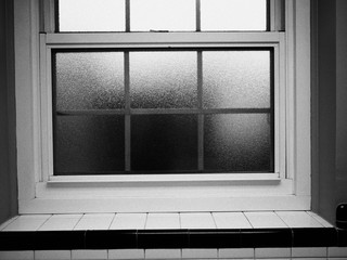 old-fashioned bathroom window in black and white