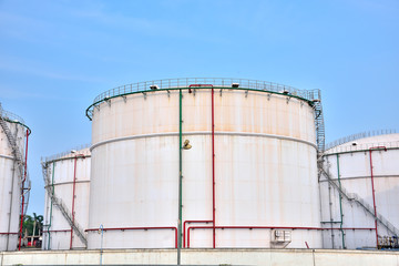 Big white gasoline and oil industry of storage tanks in the blue sky white cloud background