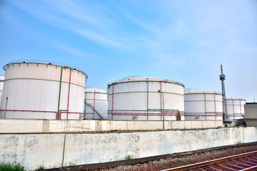 Big white gasoline and oil industry of storage tanks in the blue sky white cloud background