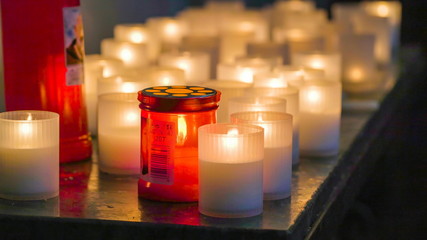 16628_The_lighted_candles_on_the_glass_in_the_cathedral_in_Palermo_Sicily_Italy.jpg