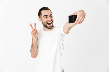 Handsome cheerful man wearing blank t-shirt