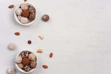 Energy balls in two  bowls on the white background.