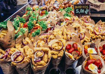 A stand with burritos at market called La Boqueria, foremost tourist landmarks in Barcelona, Spain