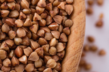 Grain buckwheat on a white acrylic background