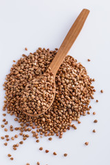 Grain buckwheat on a white acrylic background