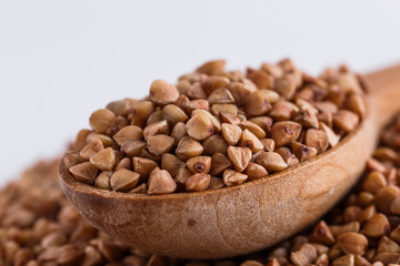 Grain buckwheat on a white acrylic background