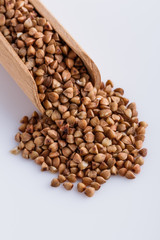 Grain buckwheat on a white acrylic background