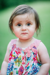 Naklejka premium Baby looking puzzled at the camera