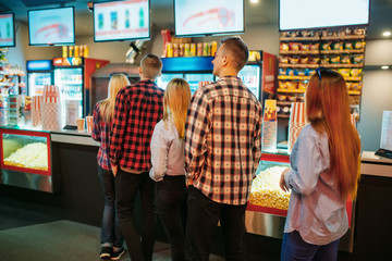 Audience choosing food in cinema bar